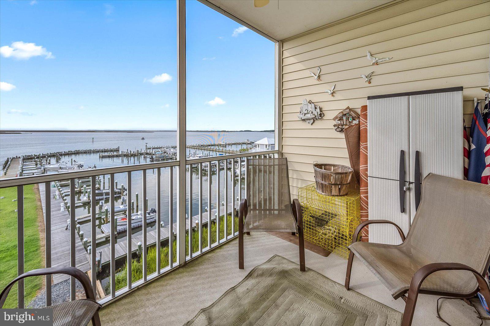 102 Williams Street, Unit 311 Crisfield, MD 21817 - Photo 31 of 57 a view of a balcony with chairs