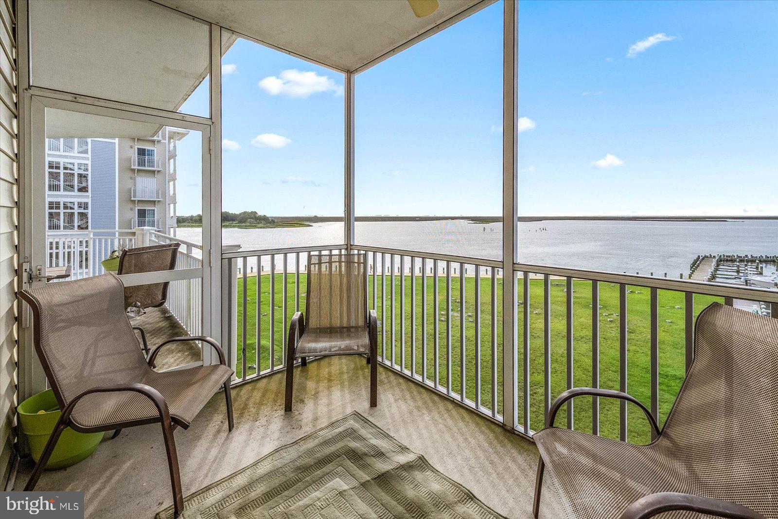 102 Williams Street, Unit 311 Crisfield, MD 21817 - Photo 32 of 57 a view of a balcony with furniture