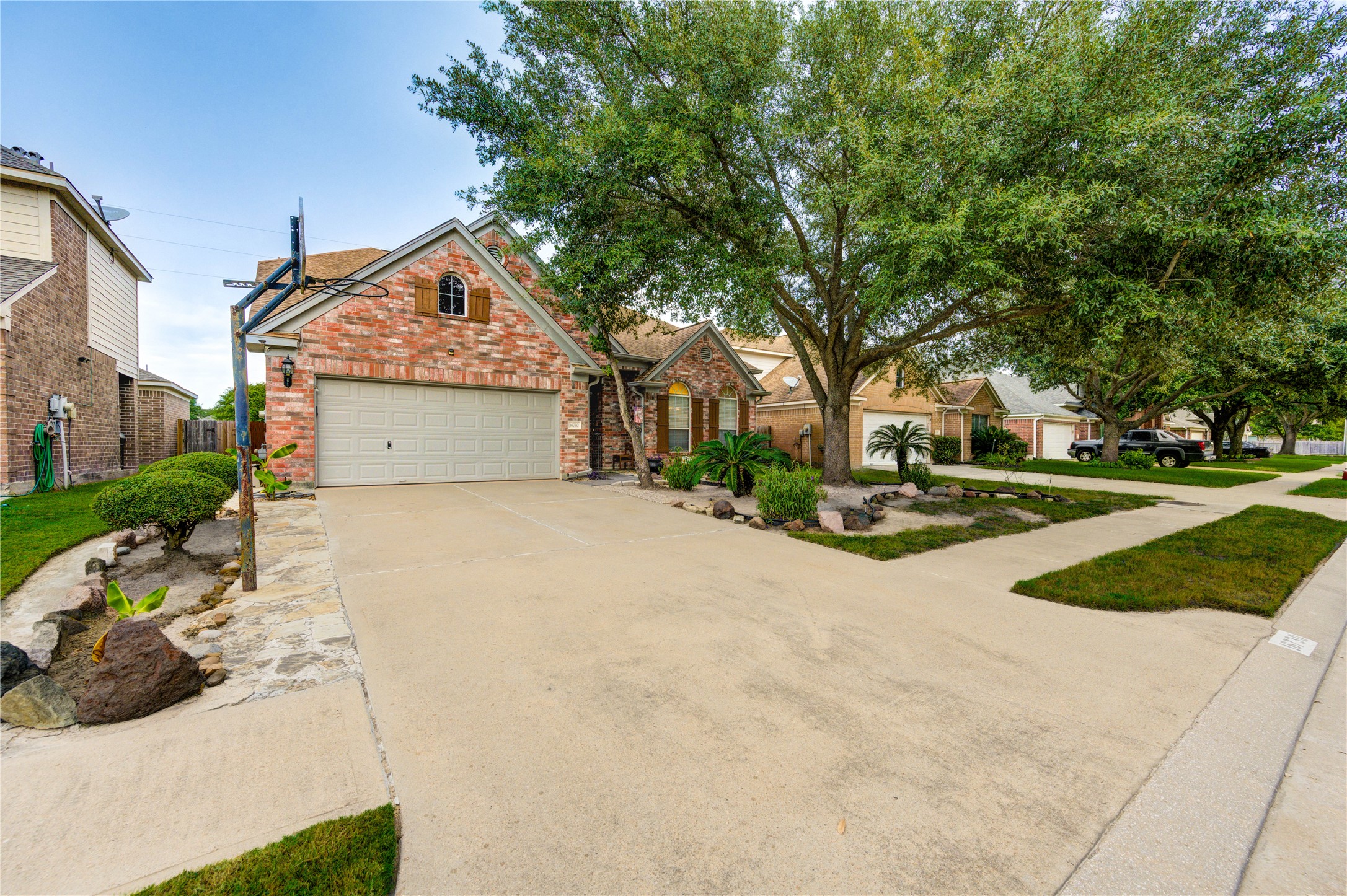 16730 Spring Barker Drive Cypress, TX 77429 - Photo 7 of 50 a view of a house with a yard and garage
