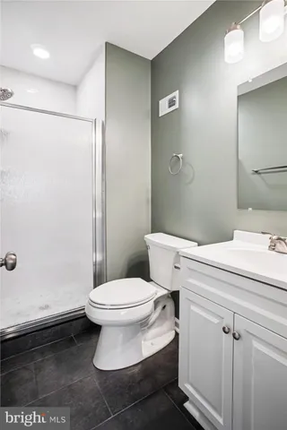 a bathroom with a toilet a sink and shower