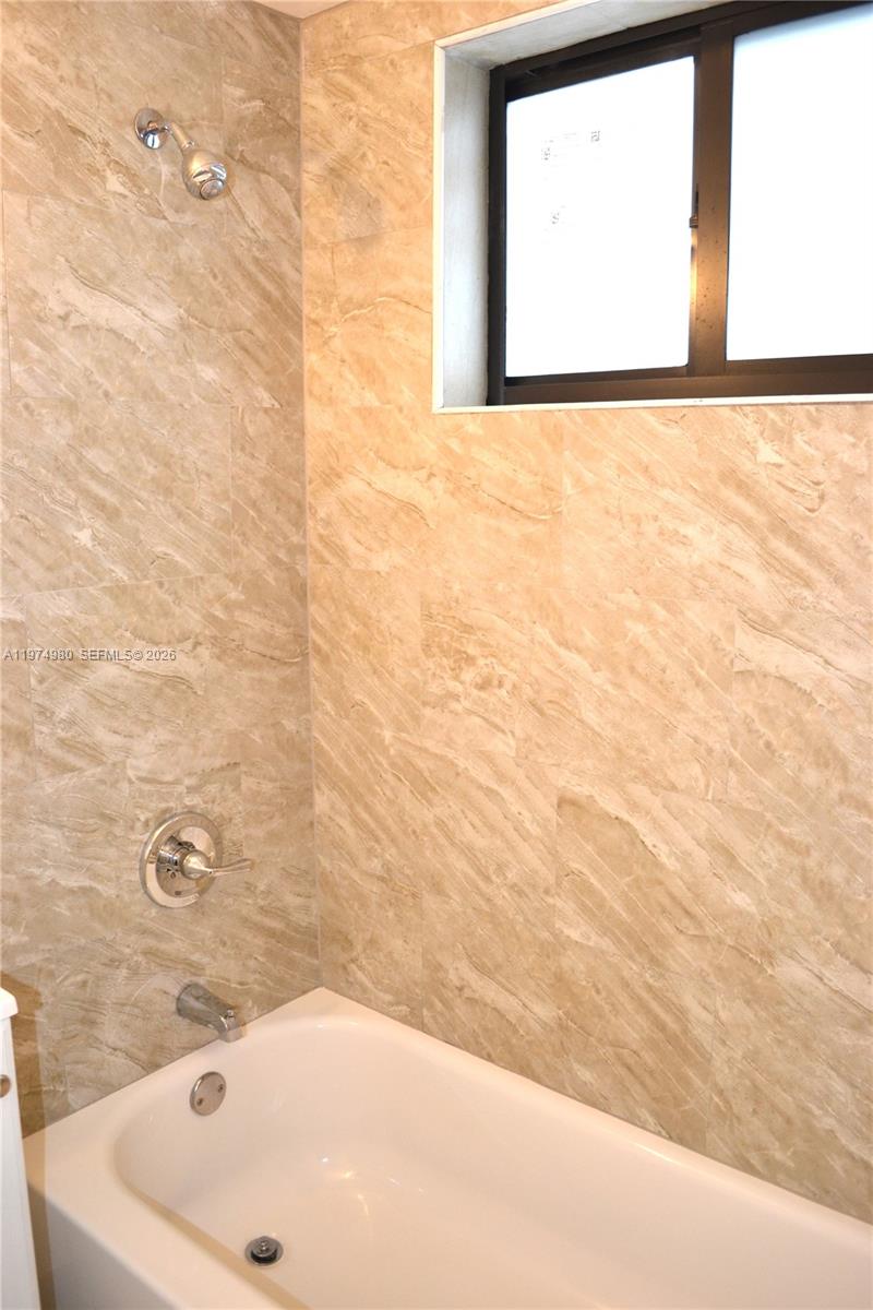 1035 Southwest 4th Street, Unit 2 Miami, FL 33130 - Photo 10 of 11 a bathroom with a bathtub