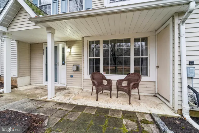 a view of a house with patio and wooden floor
