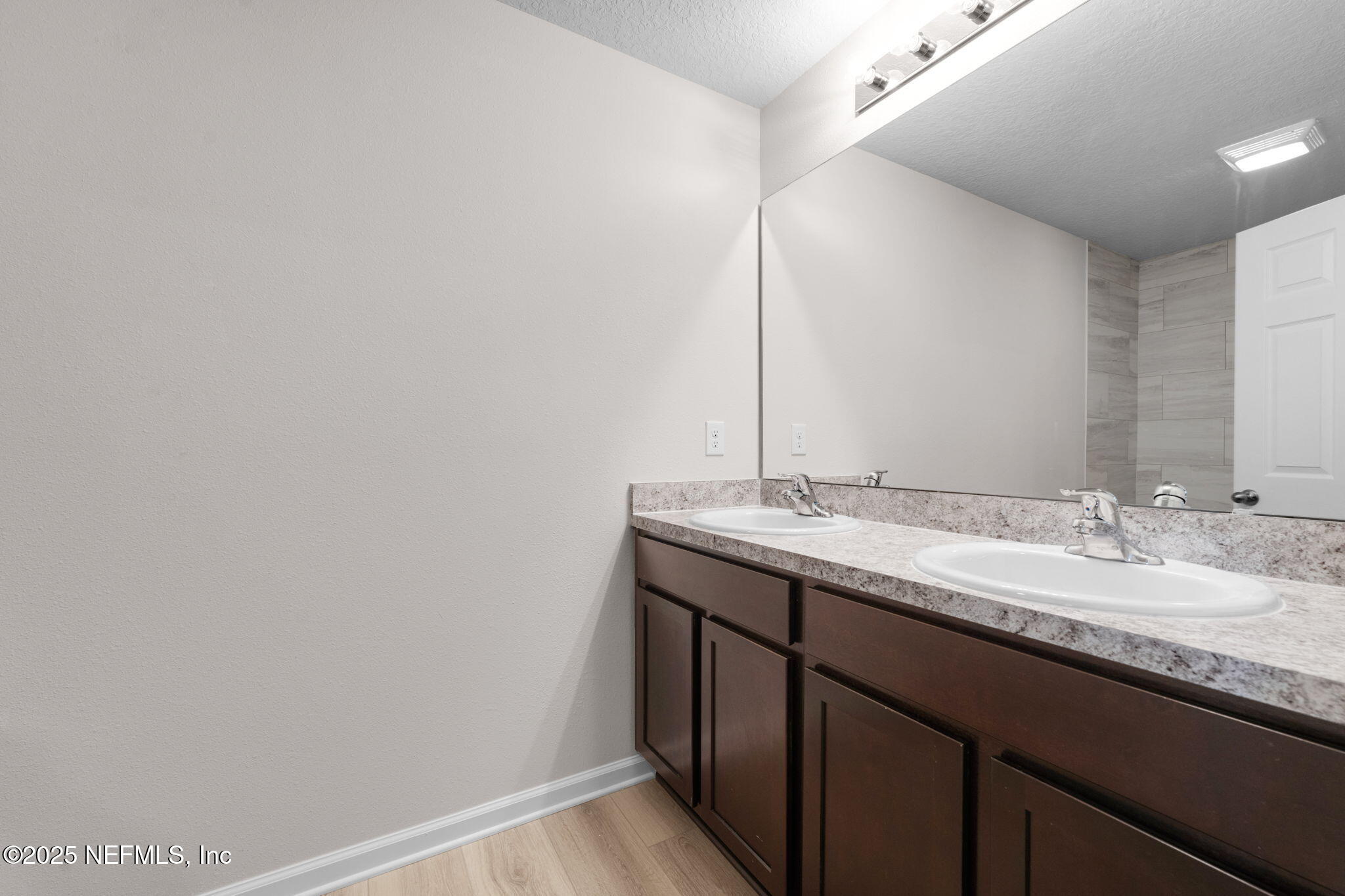 3945 Rose Street Jacksonville, FL 32208 - Photo 16 of 27 a bathroom with a granite countertop sink and a mirror