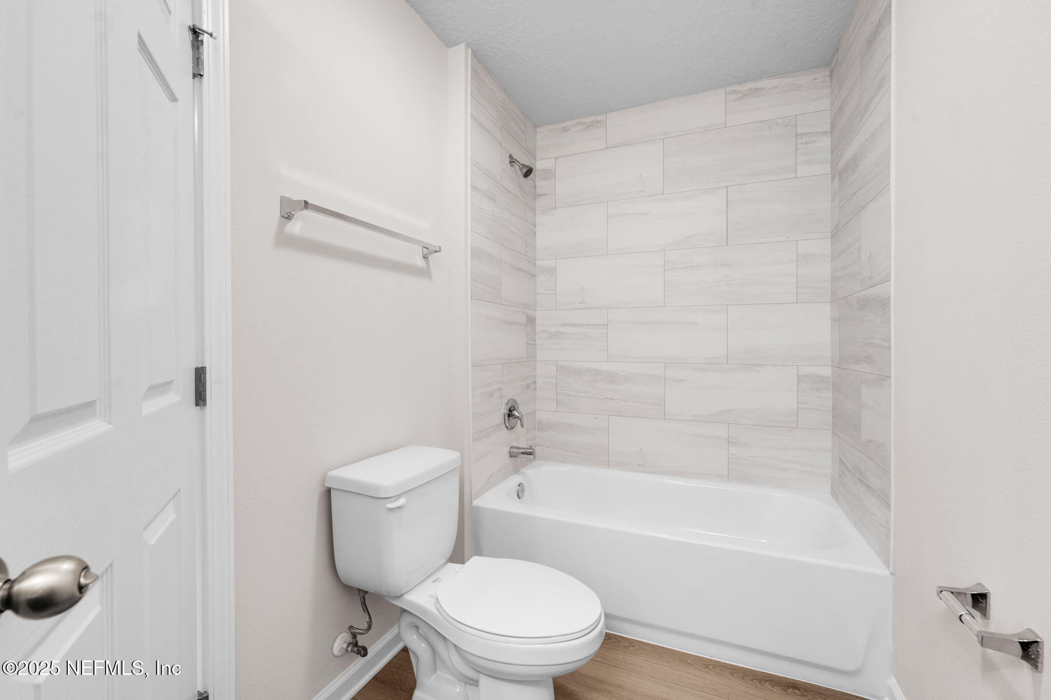 3945 Rose Street Jacksonville, FL 32208 - Photo 17 of 27 a bathroom with a toilet and a bath tub