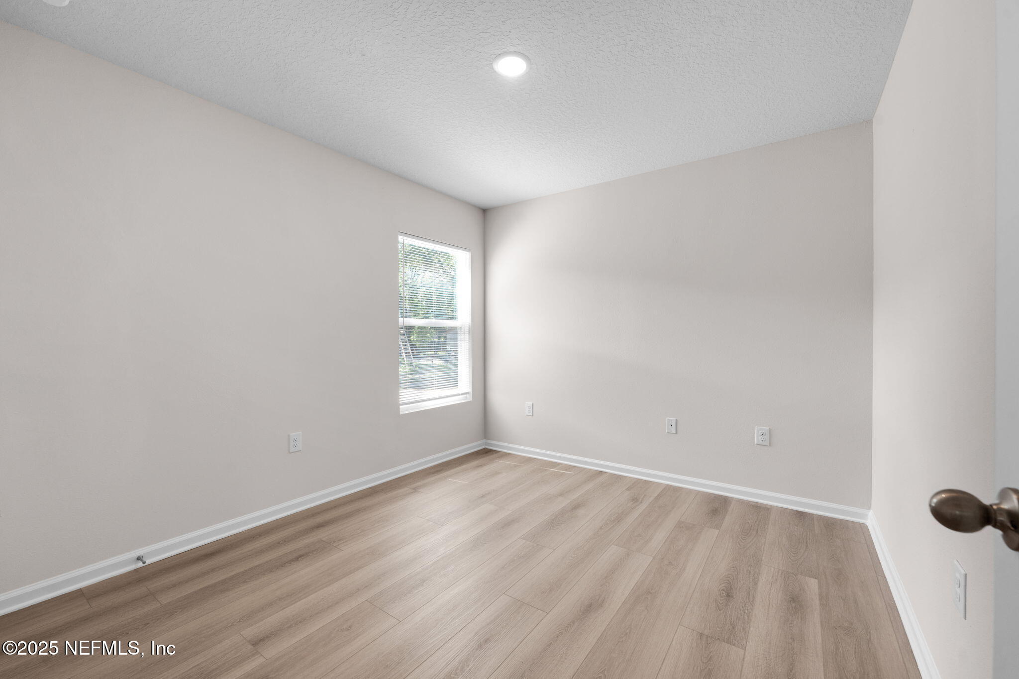 3945 Rose Street Jacksonville, FL 32208 - Photo 19 of 27 wooden floor in an empty room with a window