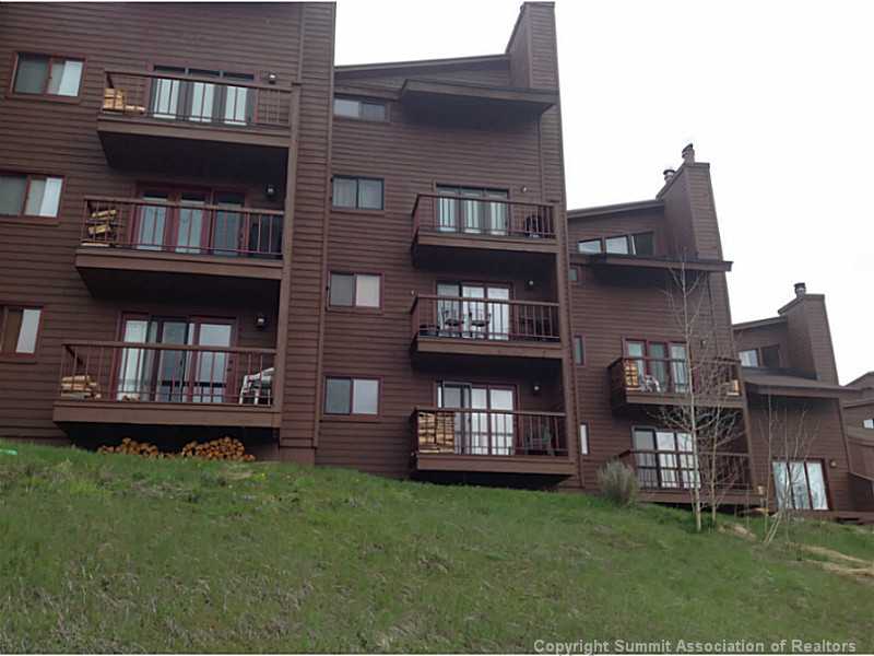 9460 Ryan Gulch Road, Unit 82 Silverthorne, CO 80498 - Photo 24 of 25 Exterior Back. Unit is on top floor of middle structure.