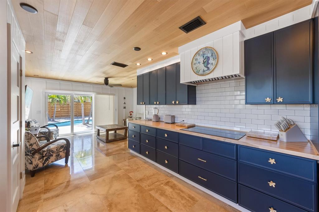 412 Alamanda Road Anna Maria, FL 34216 - Photo 13 of 43 a spacious bathroom with a double vanity sink and a mirror