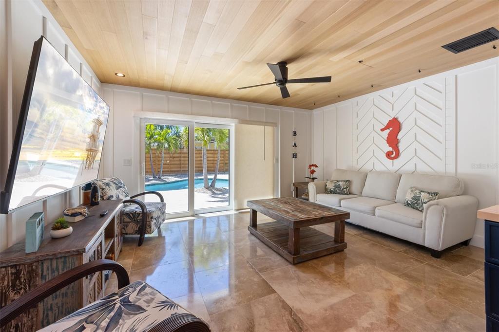 412 Alamanda Road Anna Maria, FL 34216 - Photo 15 of 43 a living room with furniture and a large window