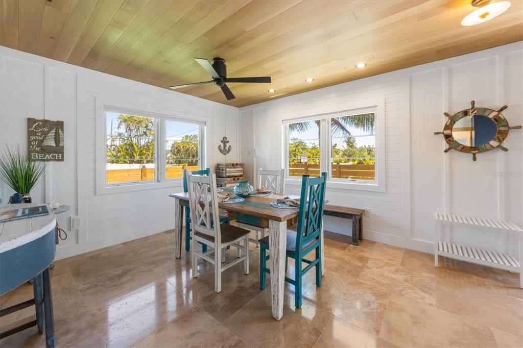412 Alamanda Road Anna Maria, FL 34216 - Photo 18 of 43 a view of a dining room with furniture and a window