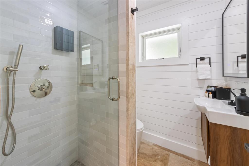 412 Alamanda Road Anna Maria, FL 34216 - Photo 21 of 43 a bathroom with a sink a toilet and shower