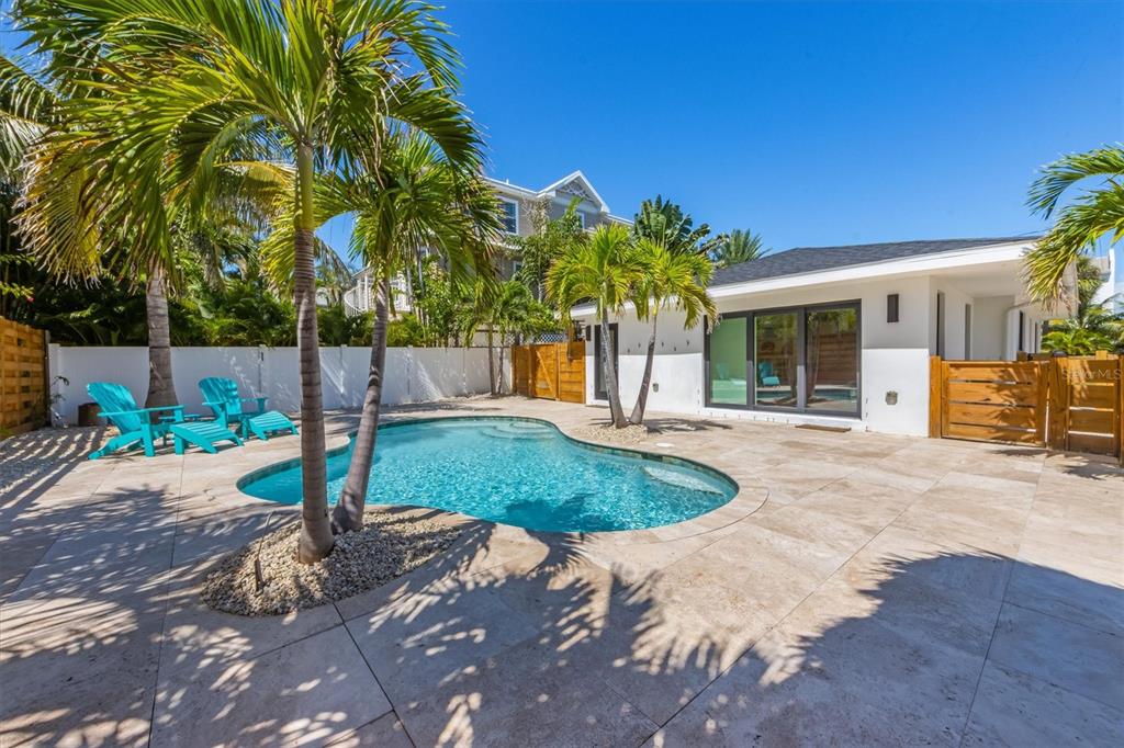 412 Alamanda Road Anna Maria, FL 34216 - Photo 26 of 43 a view of a backyard with a tree