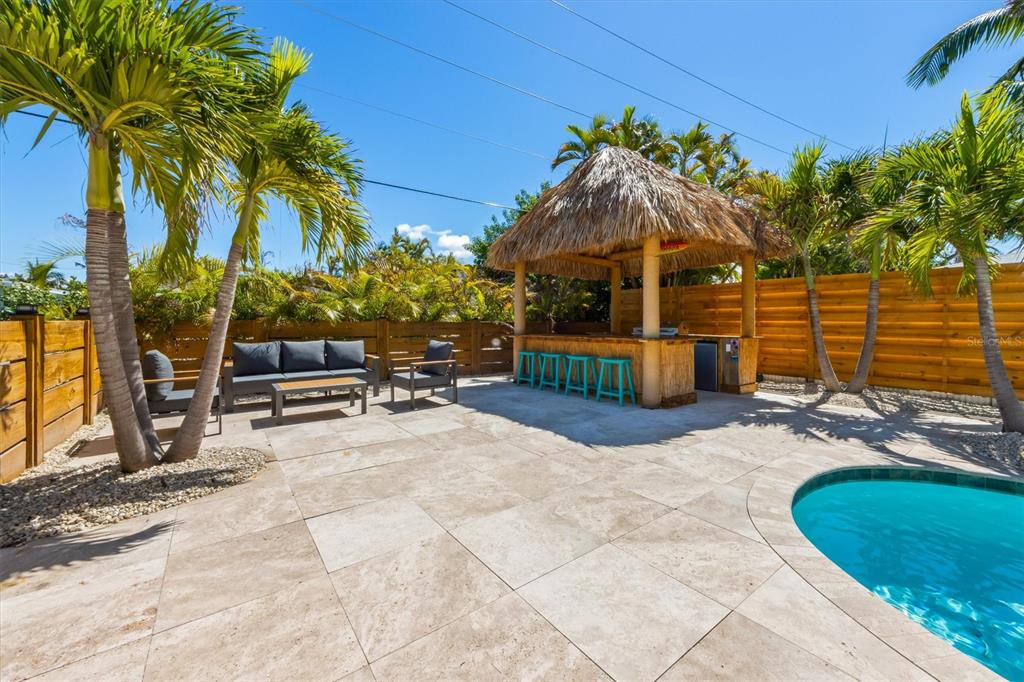 412 Alamanda Road Anna Maria, FL 34216 - Photo 30 of 43 a view of a backyard with a patio