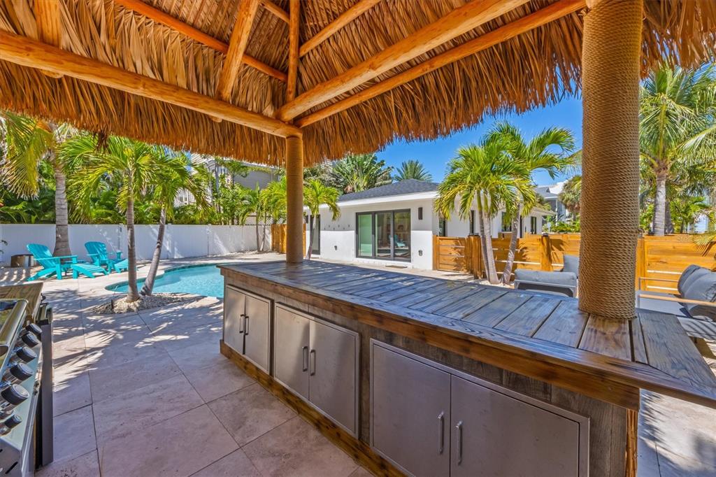 412 Alamanda Road Anna Maria, FL 34216 - Photo 34 of 43 a view of a backyard with a patio