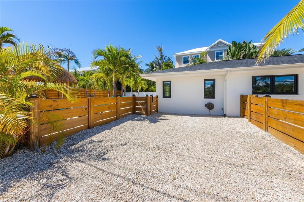 412 Alamanda Road Anna Maria, FL 34216 - Photo 5 of 43 a view of a house with backyard and a tree
