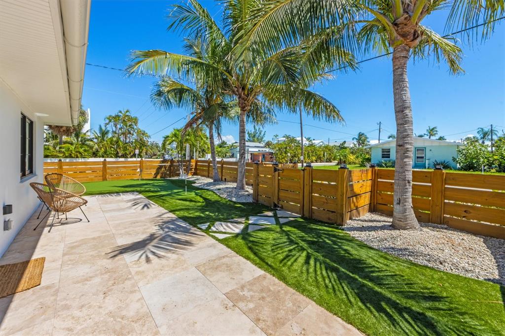 412 Alamanda Road Anna Maria, FL 34216 - Photo 6 of 43 a garden view with a seating space