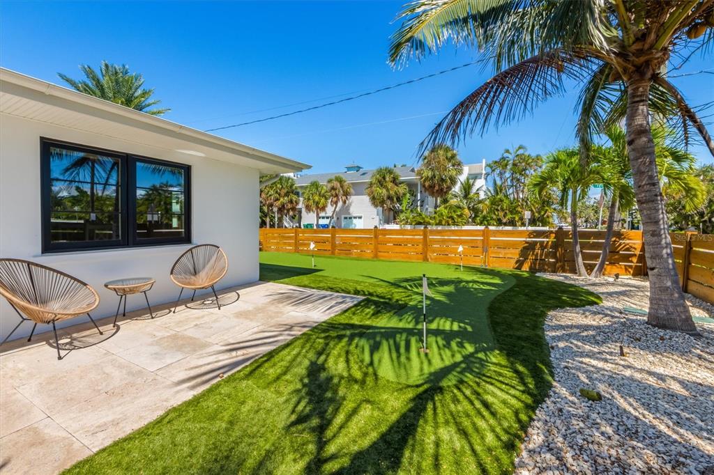 412 Alamanda Road Anna Maria, FL 34216 - Photo 7 of 43 a view of a swimming pool with a lounge chairs