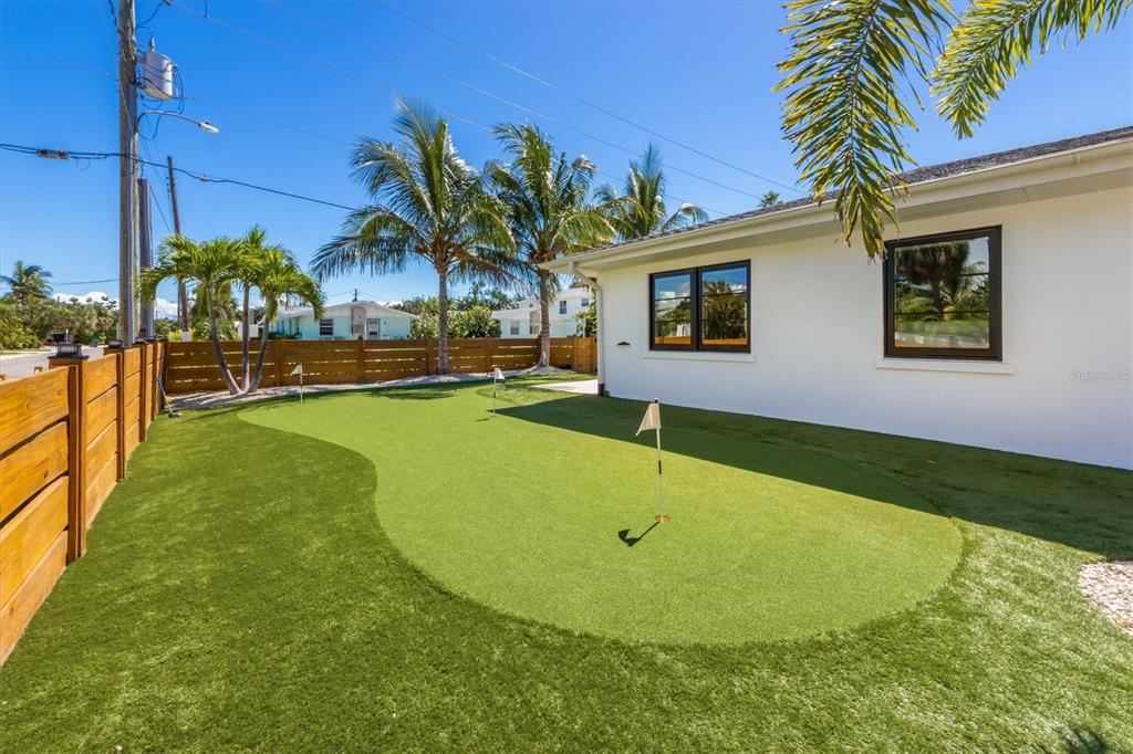 412 Alamanda Road Anna Maria, FL 34216 - Photo 9 of 43 a view of a backyard with swimming pool