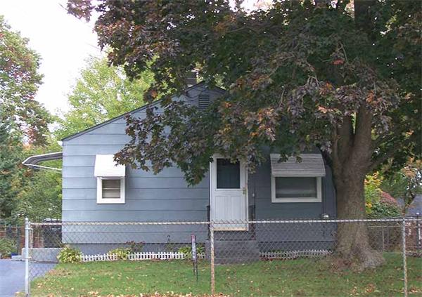 a view of house with backyard