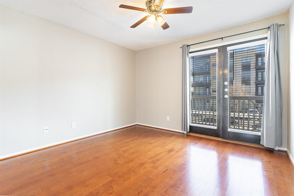 5934 Sandhurst Lane, Unit 207 Dallas, TX 75206 - Photo 14 of 31 a view of an empty room with a window