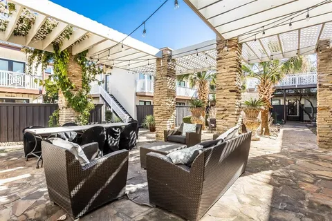 a front view of a house with outdoor seating