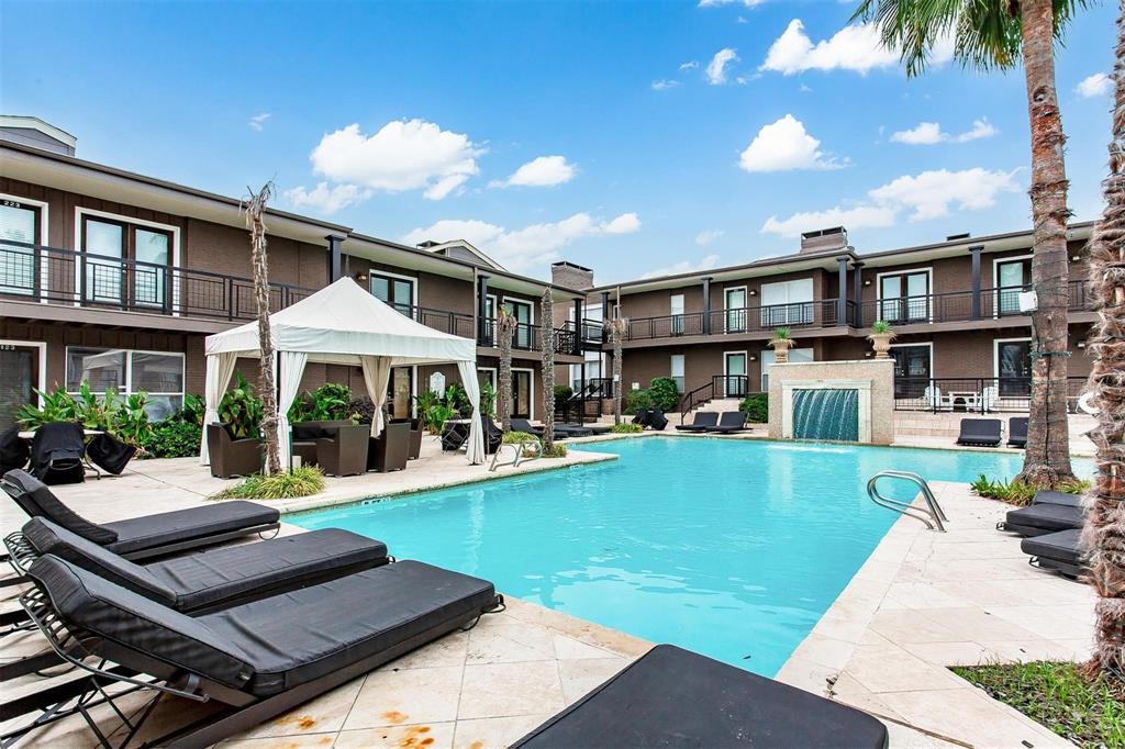5934 Sandhurst Lane, Unit 207 Dallas, TX 75206 - Photo 27 of 31 a view of a house with a yard patio and swimming pool