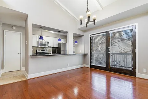 a view of a kitchen with a sink and cabinet area
