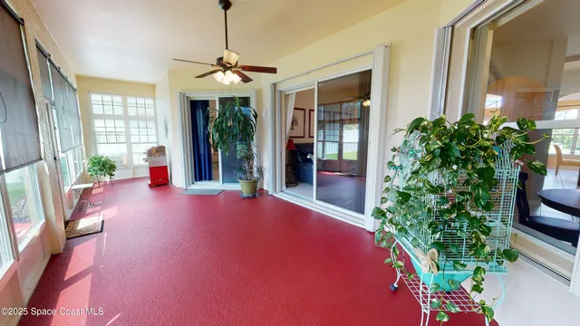 a view of livingroom with furniture and floor to ceiling window