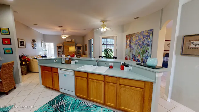 a kitchen with stainless steel appliances granite countertop sink stove and cabinets