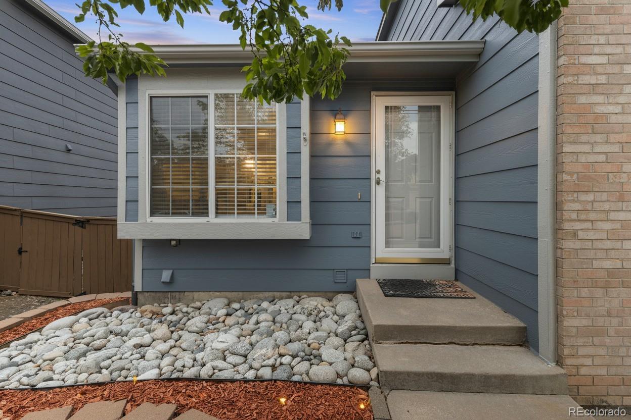 10565 Hyacinth Place Highlands Ranch, CO 80129 - Photo 2 of 33 a front view of a house with a yard
