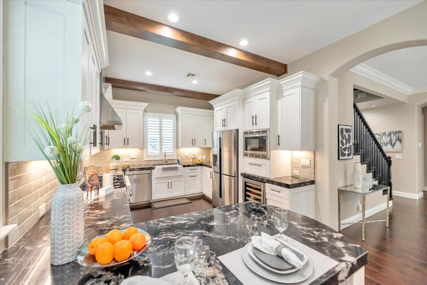 2160 Gullane Way Gilroy, CA 95020 - Photo 11 of 40 a living room with stainless steel appliances furniture a rug and a kitchen view