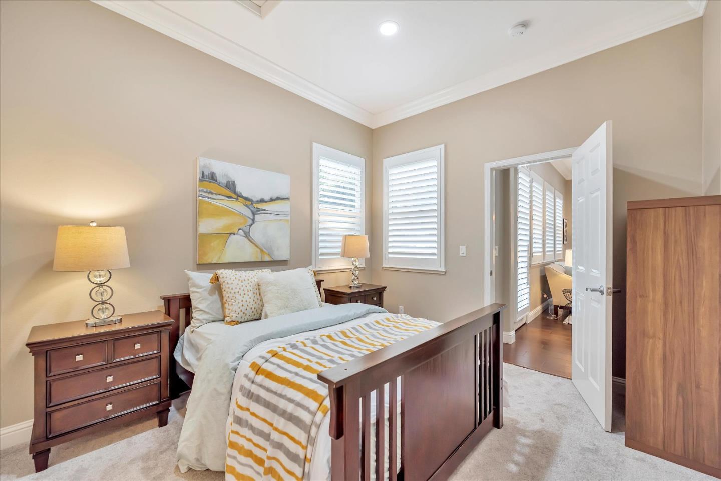 2160 Gullane Way Gilroy, CA 95020 - Photo 16 of 40 a bedroom with a bed and a lamp