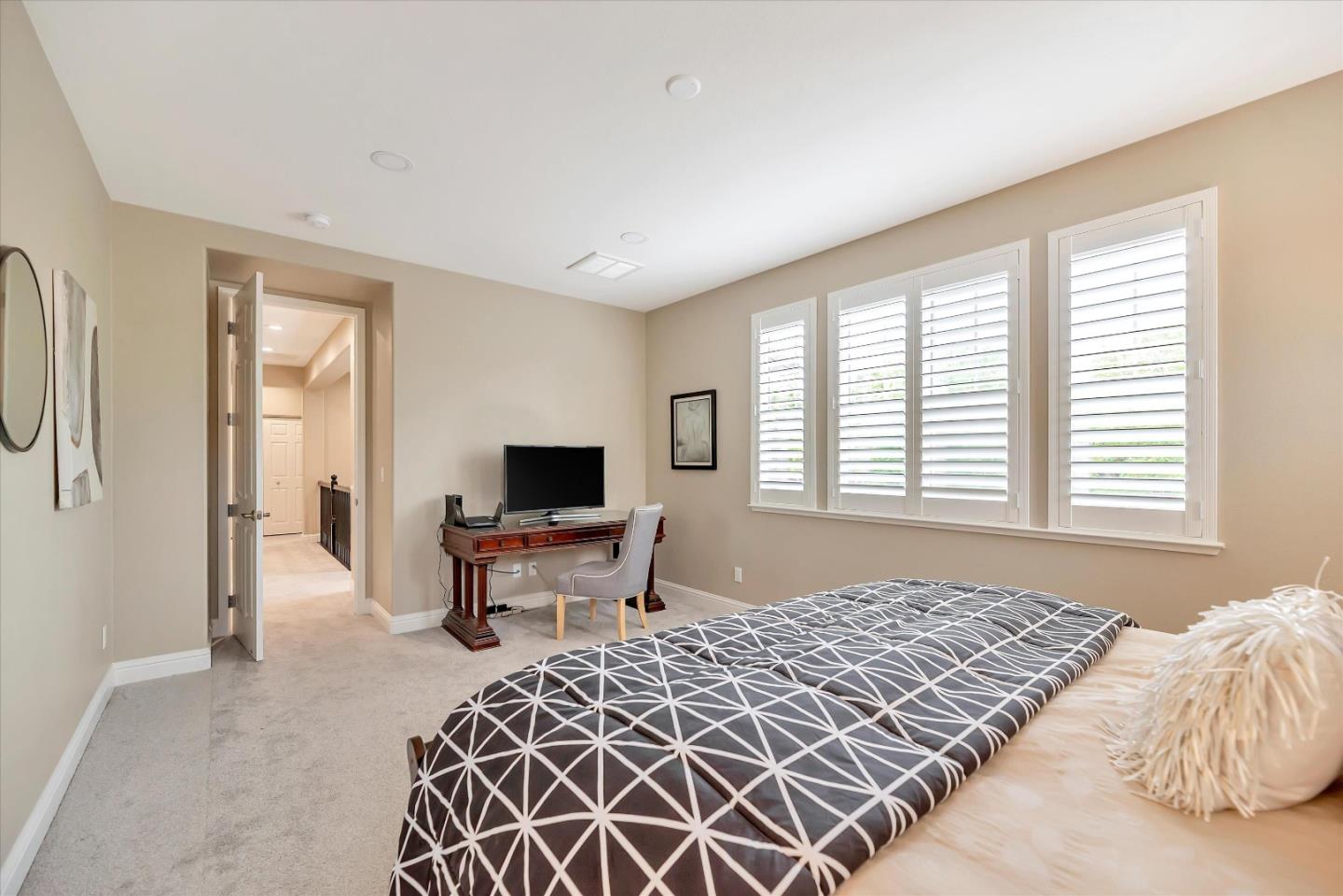 2160 Gullane Way Gilroy, CA 95020 - Photo 25 of 40 a bedroom with a bed and a television