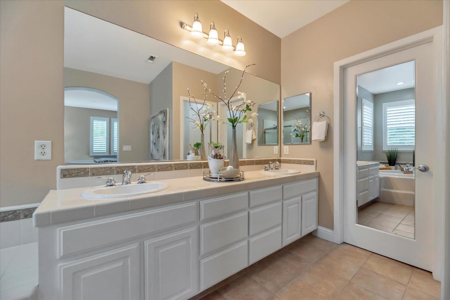 2160 Gullane Way Gilroy, CA 95020 - Photo 28 of 40 a en suite bathroom with double sink and a mirror