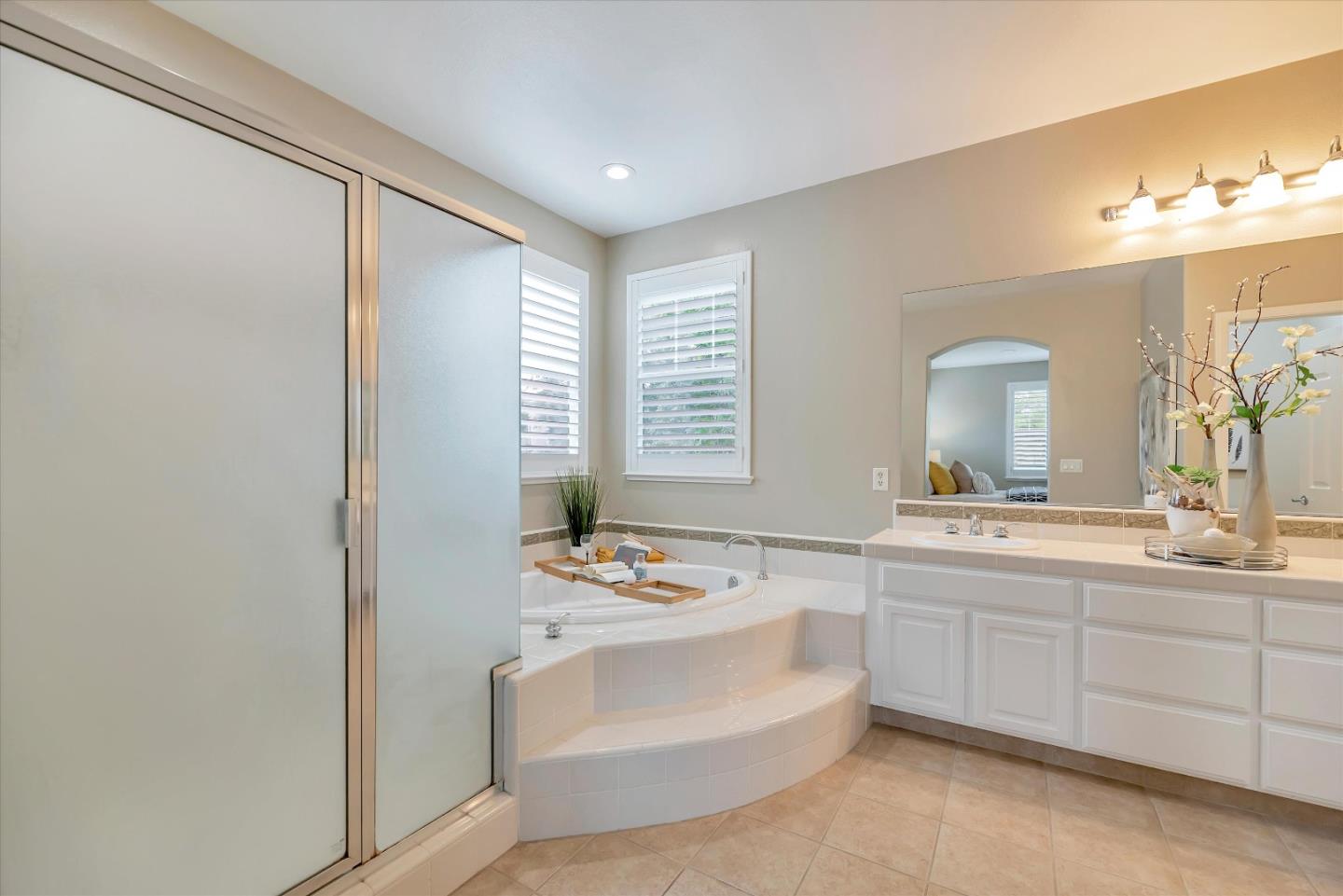 2160 Gullane Way Gilroy, CA 95020 - Photo 30 of 40 a bathroom with a sink vanity tub and a mirror