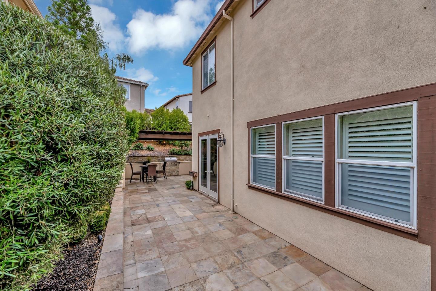 2160 Gullane Way Gilroy, CA 95020 - Photo 36 of 40 a view of a patio with table and chairs and potted plants