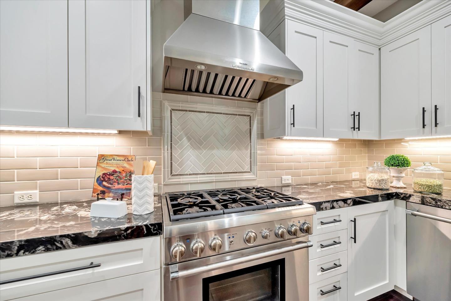 2160 Gullane Way Gilroy, CA 95020 - Photo 9 of 40 a kitchen with granite countertop stainless steel appliances a stove and cabinets