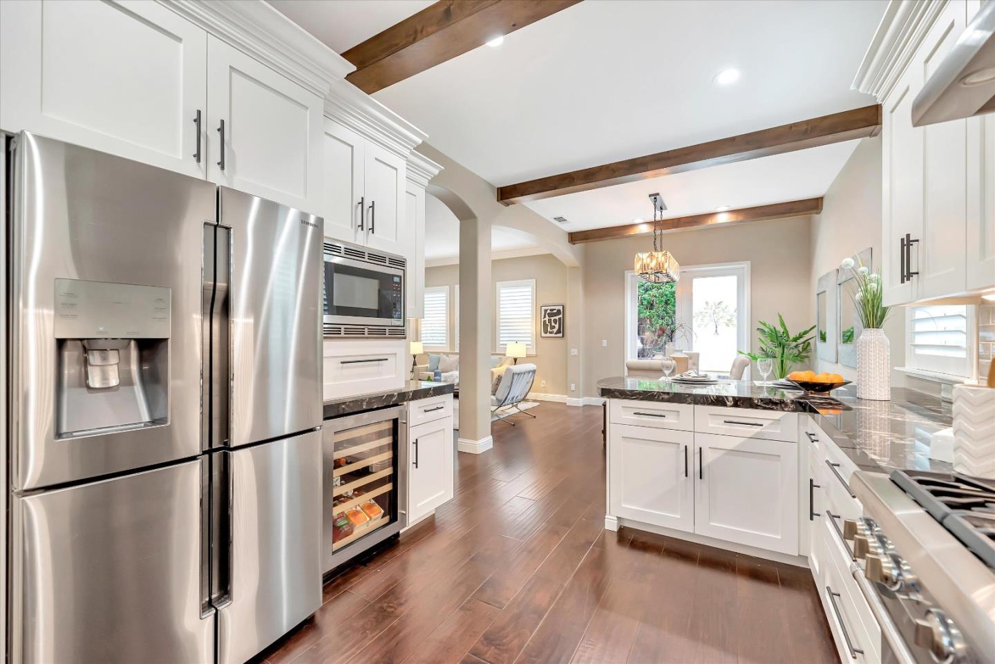 2160 Gullane Way Gilroy, CA 95020 - Photo 10 of 40 a kitchen with stainless steel appliances a refrigerator sink and stove