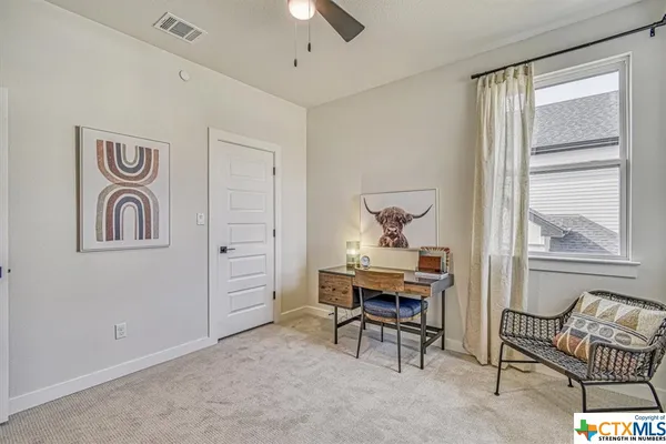 a bathroom with a bathtub shower sink vanity and toilet