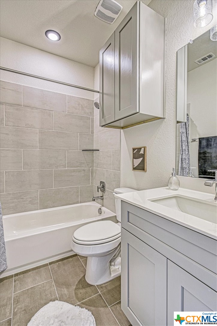 2600 Gattis School Road Round Rock, TX 78664 - Photo 27 of 36 a bathroom with a sink toilet and shower