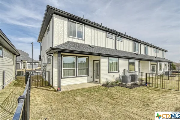 a front view of a house with parking space