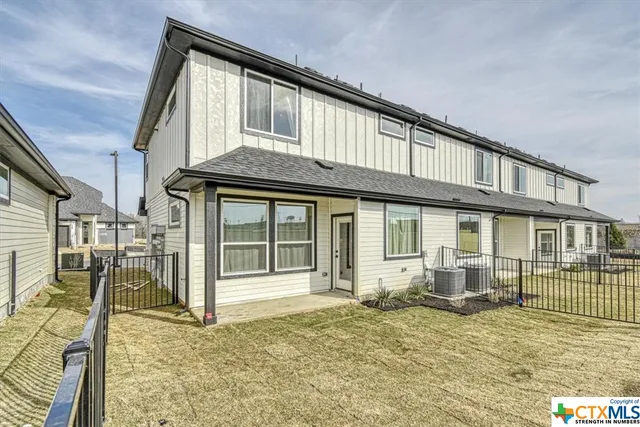 a front view of a house with parking space