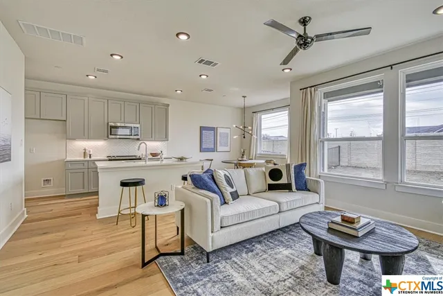 a living room with furniture and a window