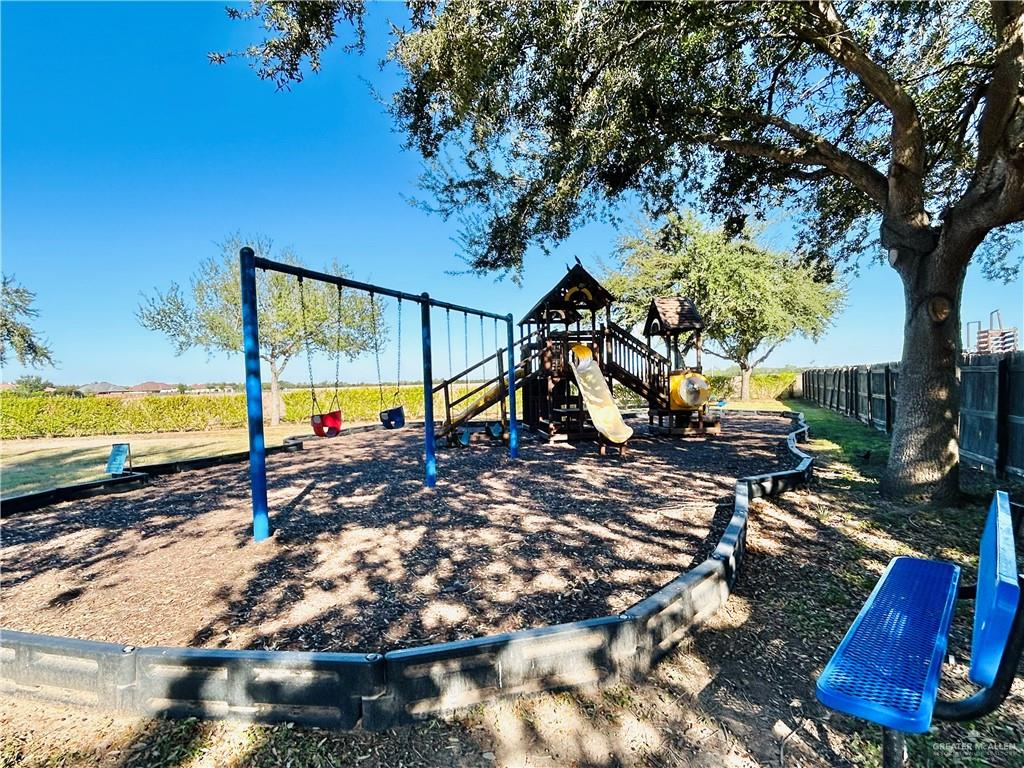 4630 Resaca S Street Harlingen, TX 78552 - Photo 4 of 7 a view of a swimming pool with a yard
