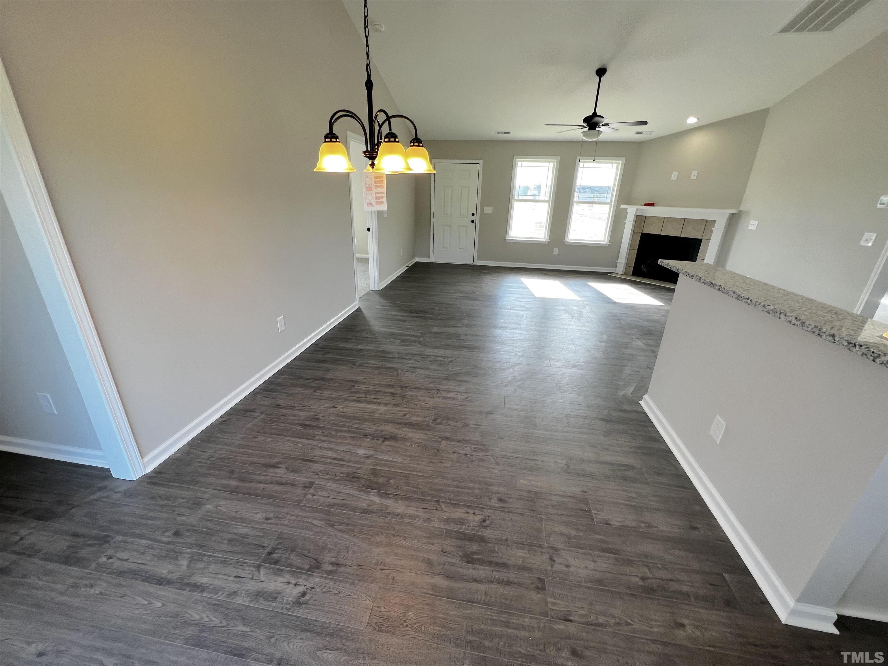 96 Mamie Road Benson, NC 27504 - Photo 10 of 20 wooden floor in an empty room with a window