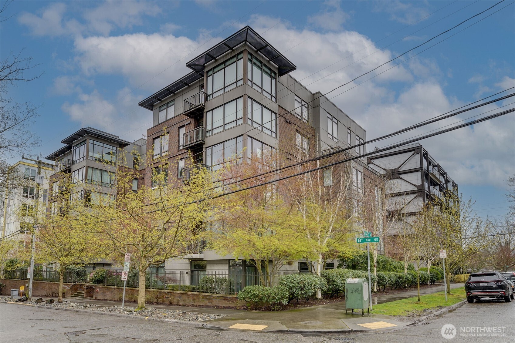4547 8th Avenue Northeast, Unit 204 Seattle, WA 98105 - Photo 1 of 22 a view of a street with a building in the background