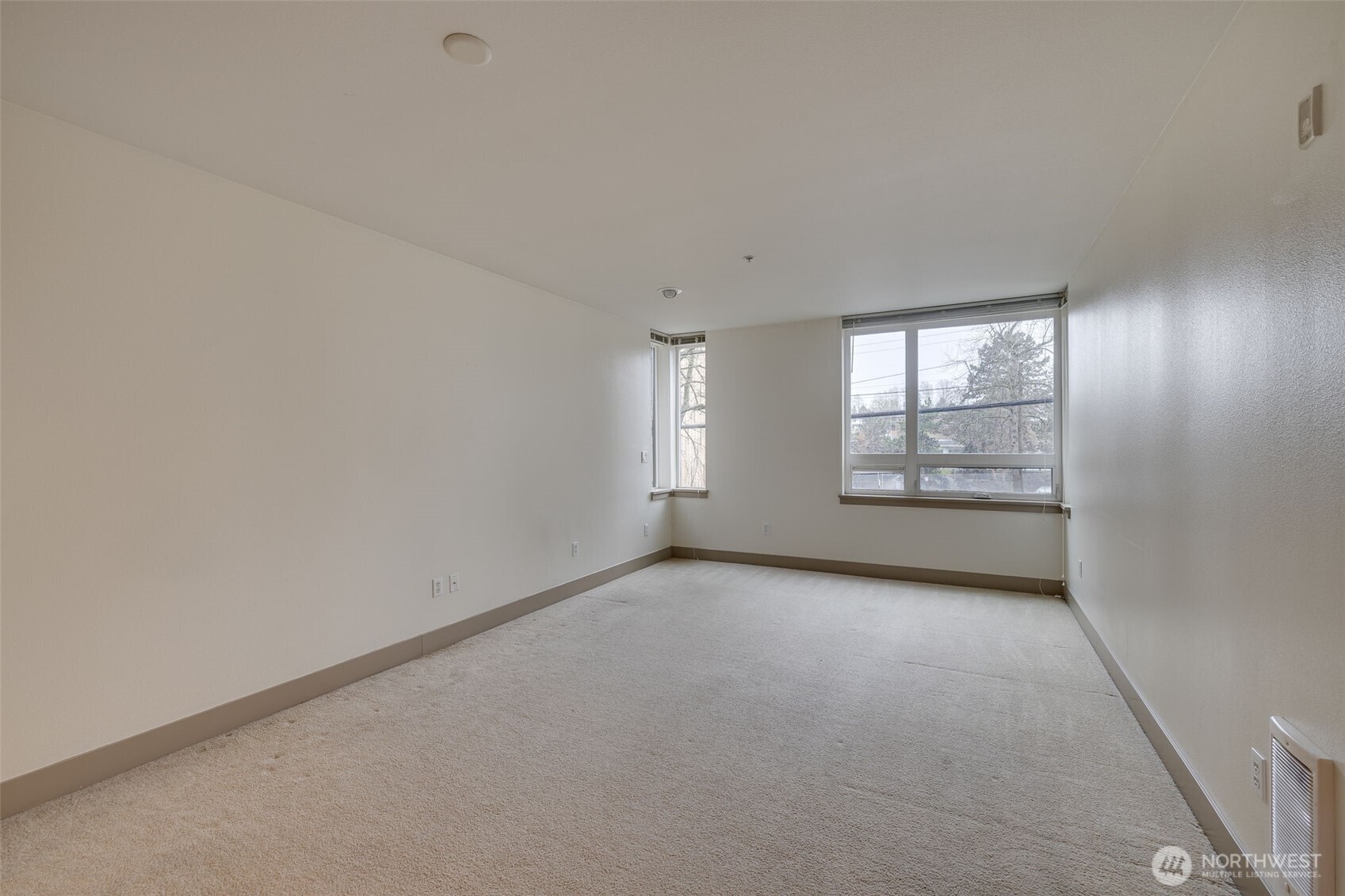4547 8th Avenue Northeast, Unit 204 Seattle, WA 98105 - Photo 16 of 22 an empty room with windows