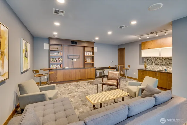 a living room with furniture and a large window