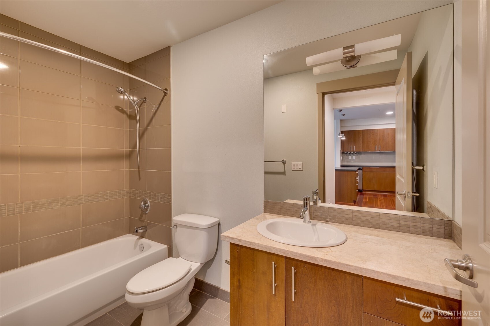 4547 8th Avenue Northeast, Unit 204 Seattle, WA 98105 - Photo 9 of 22 a bathroom with a sink and a mirror