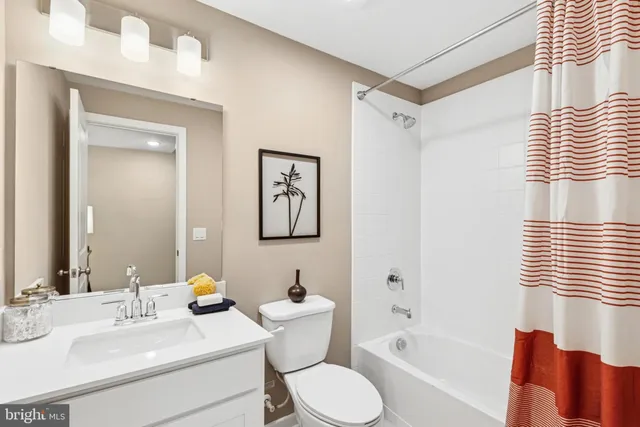 a bathroom with a toilet a sink and a bathtub