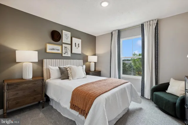 a bedroom with a bed and a couch